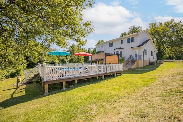 2 Joseph St, West Haverstraw, NY 10993 - back of house featuring stairway, central AC unit, a deck, and a yard