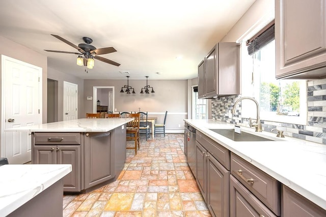 2 Joseph St, West Haverstraw, NY 10993 - kitchen with a sink, gray cabinetry, dishwasher, and tasteful backsplash