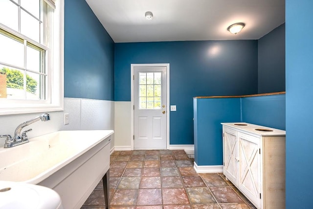 2 Joseph St, West Haverstraw, NY 10993 - bathroom featuring vanity, baseboards, and stone finish flooring