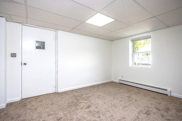2 Joseph St, West Haverstraw, NY 10993 - empty room with a baseboard heating unit, carpet, a drop ceiling, and baseboards