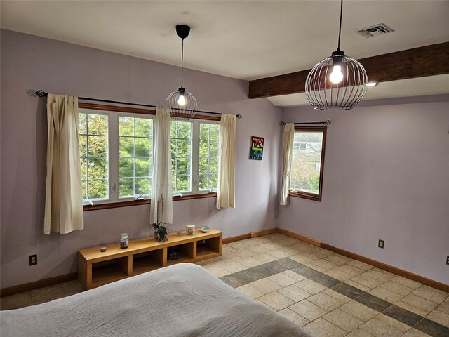 526 Hazel Dr, Woodmere, NY 11598 - bedroom with baseboards, beam ceiling, and stone tile floors