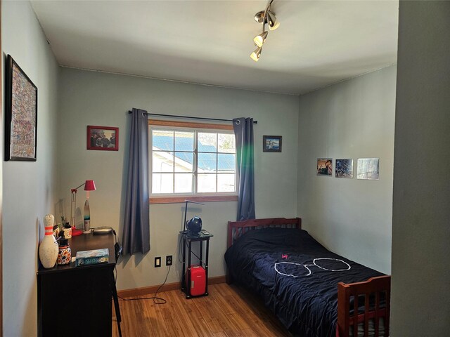 526 Hazel Dr, Woodmere, NY 11598 - bedroom with wood finished floors and baseboards