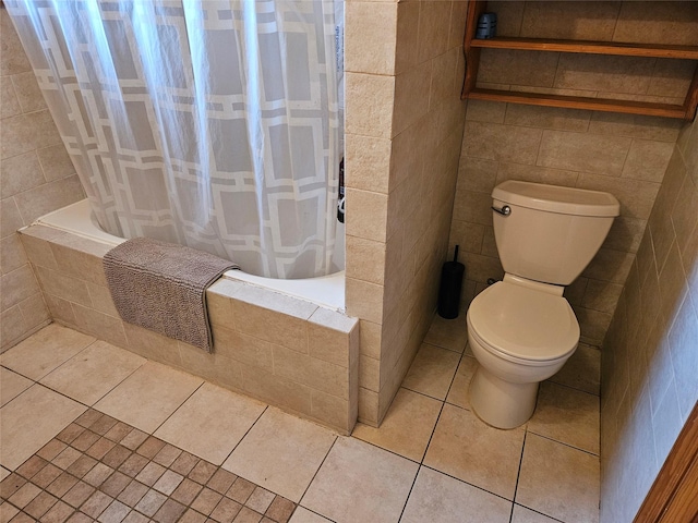 526 Hazel Dr, Woodmere, NY 11598 - bathroom featuring tiled shower / bath, toilet, and tile patterned floors