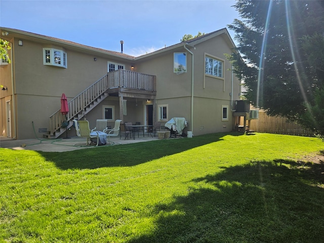 526 Hazel Dr, Woodmere, NY 11598 - rear view of house featuring stucco siding, stairway, and a patio area