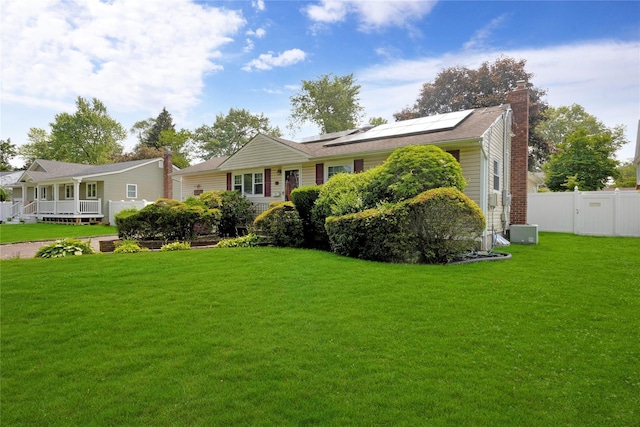 53 Wiltshire Dr, Commack, NY 11725 - ranch-style home featuring solar panels and a chimney
