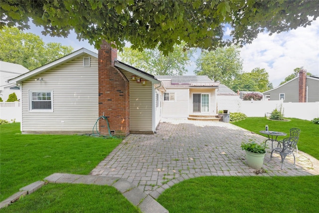 53 Wiltshire Dr, Commack, NY 11725 - back of house featuring a chimney, a patio, and decorative driveway