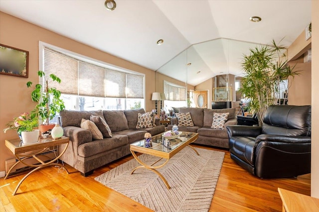 22 Cheshire Rd, Inwood, NY 11096 - living room featuring lofted ceiling and wood finished floors