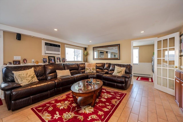22 Cheshire Rd, Inwood, NY 11096 - living room featuring a baseboard heating unit, an AC wall unit, and a wainscoted wall
