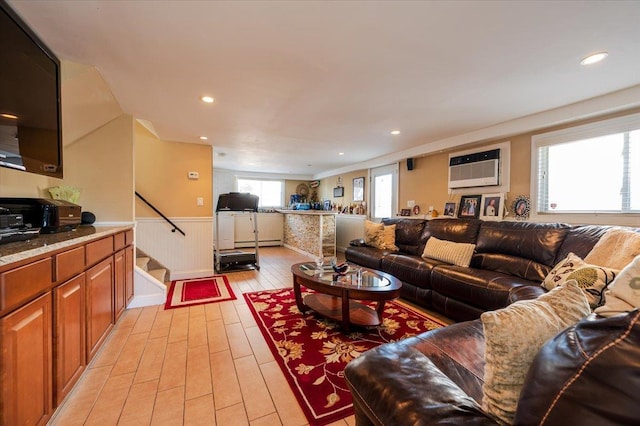 22 Cheshire Rd, Inwood, NY 11096 - living room with wainscoting, light wood-type flooring, stairs, a wall unit AC, and recessed lighting