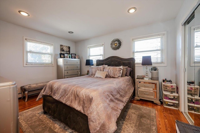 22 Cheshire Rd, Inwood, NY 11096 - bedroom with dark wood-style floors and recessed lighting