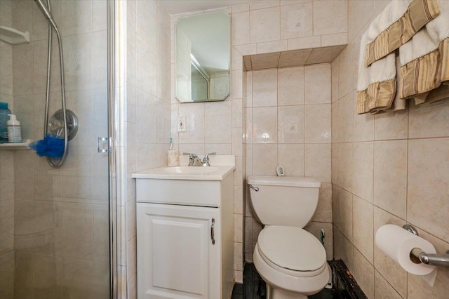 22 Cheshire Rd, Inwood, NY 11096 - bathroom featuring tile walls, a shower stall, vanity, and toilet