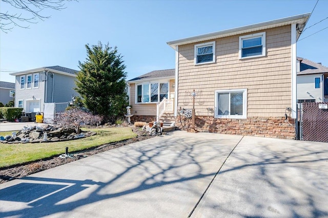 22 Cheshire Rd, Inwood, NY 11096 - rear view of house with a patio area