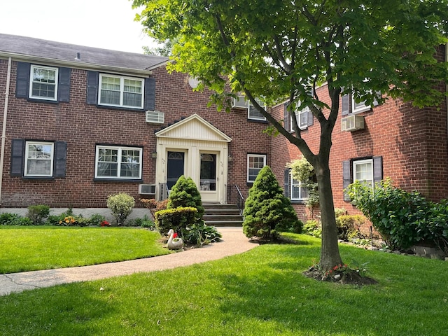 210-12 69th Ave Lower, Lower, Oakland Gardens, NY 11364 - view of front of house featuring brick siding and a front lawn