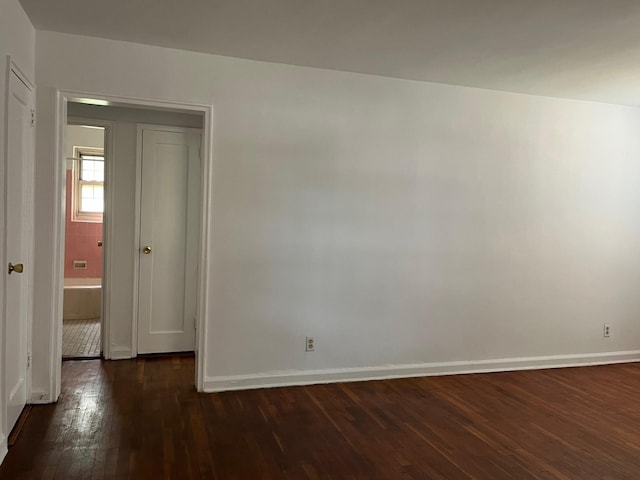 210-12 69th Ave Lower, Lower, Oakland Gardens, NY 11364 - spare room with dark wood-style floors and baseboards