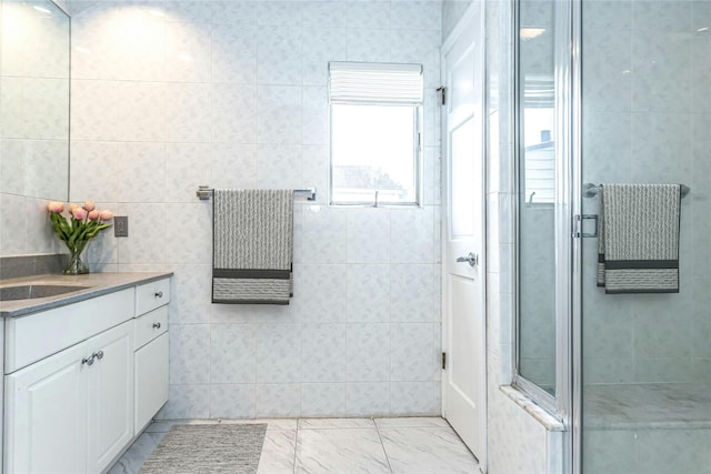 462 Locust Ter, West Hempstead, NY 11552 - bathroom with vanity, a stall shower, and marble look tile flooring