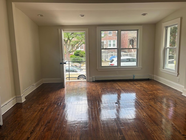 4363 Gunther Ave, Bronx, NY 10466 - empty room with a baseboard radiator, hardwood / wood-style floors, and baseboards