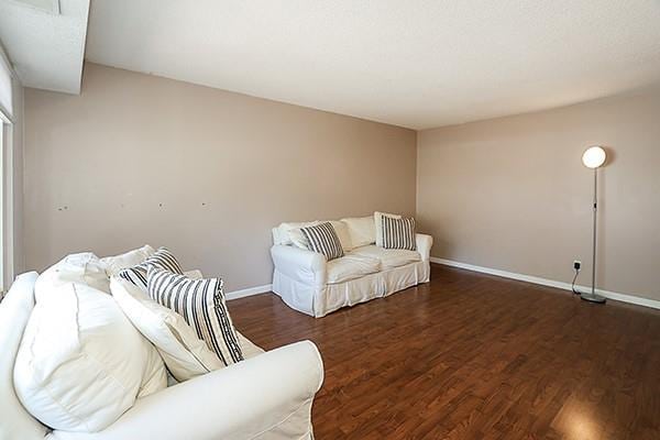 223 Springmeadow Dr Unit E, Holbrook, NY 11741 - living area with wood finished floors and baseboards