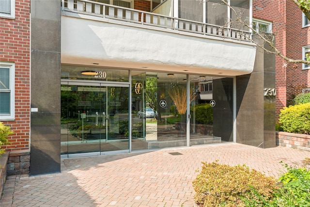 230 Garth Rd Unit 1A1, Scarsdale, NY 10583 - doorway to property featuring brick siding