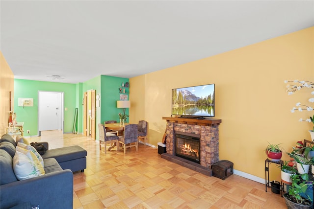 230 Garth Rd Unit 1A1, Scarsdale, NY 10583 - living area with a stone fireplace and baseboards