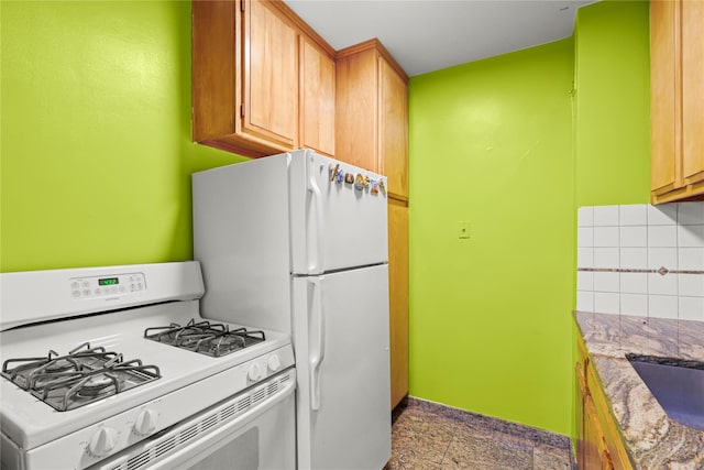 230 Garth Rd Unit 1A1, Scarsdale, NY 10583 - kitchen with white appliances, decorative backsplash, baseboards, and light stone countertops