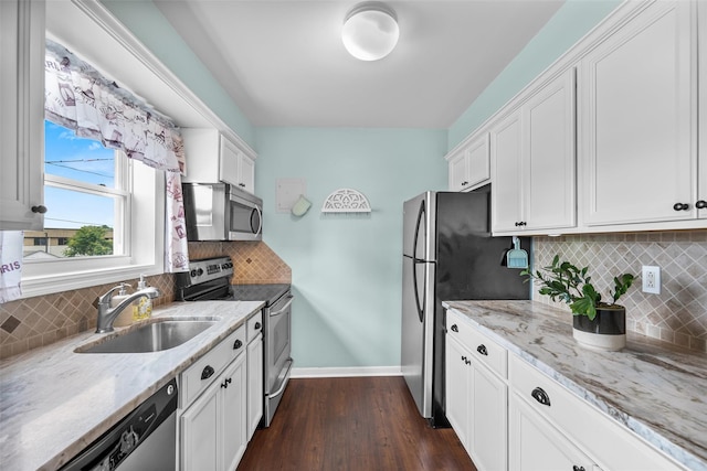 1548 Rte 9 Unit 7C, Wappingers Falls, NY 12590 - kitchen featuring appliances with stainless steel finishes, white cabinets, dark wood-type flooring, and light stone countertops