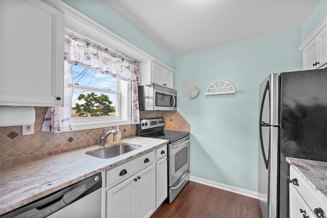 1548 Rte 9 Unit 7C, Wappingers Falls, NY 12590 - kitchen featuring stainless steel appliances, dark wood-style flooring, backsplash, light stone countertops, and white cabinetry