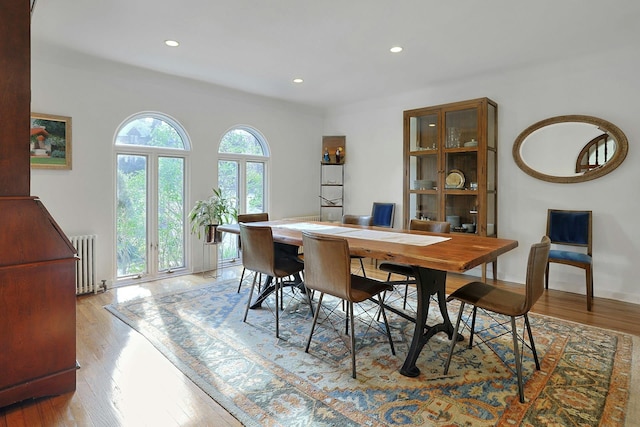 286 Lyncroft Rd, New Rochelle, NY 10804 - dining room with radiator, light wood-type flooring, and recessed lighting