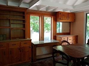 71 Honeywell Ln, Hyde Park, NY 12538 - kitchen featuring brown cabinetry, beamed ceiling, light countertops, and open shelves
