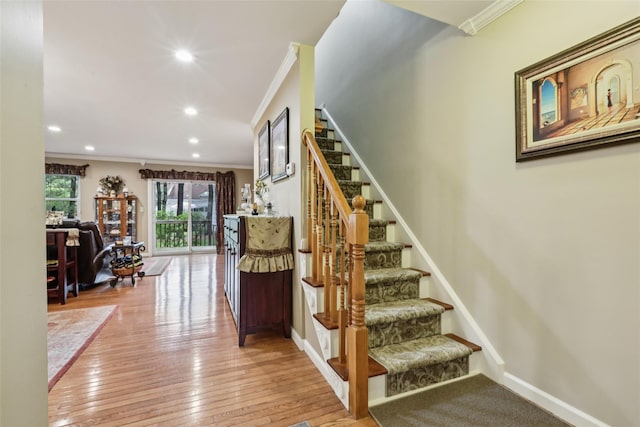 438 Genesee Ct, Suffern, NY 10901 - staircase featuring crown molding, wood-type flooring, and recessed lighting