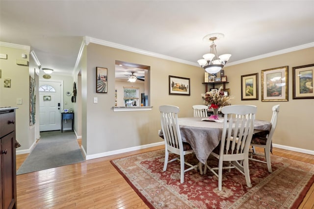 438 Genesee Ct, Suffern, NY 10901 - dining space with crown molding, wood-type flooring, and a ceiling fan