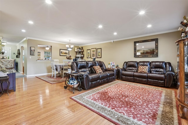 438 Genesee Ct, Suffern, NY 10901 - living area with light wood-style floors, recessed lighting, ornamental molding, and a chandelier