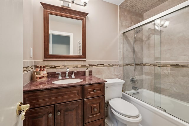 438 Genesee Ct, Suffern, NY 10901 - full bathroom with vanity, tile walls, and shower / bath combination with glass door