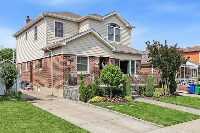 15707 22nd Ave, Whitestone, NY 11357 - view of front of home featuring a front yard, brick siding, and roof with shingles