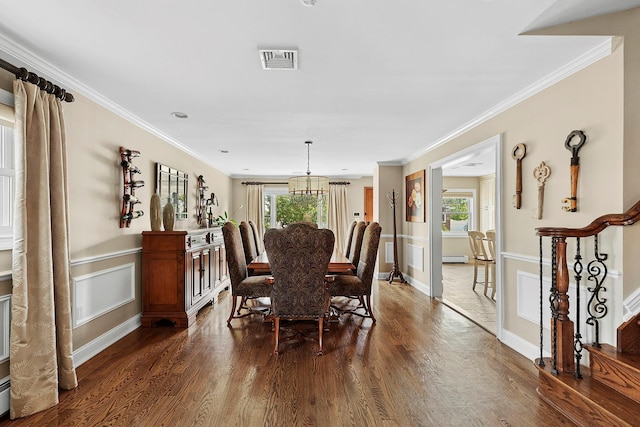 15707 22nd Ave, Whitestone, NY 11357 - dining space with dark wood-type flooring, stairway, ornamental molding, and wainscoting