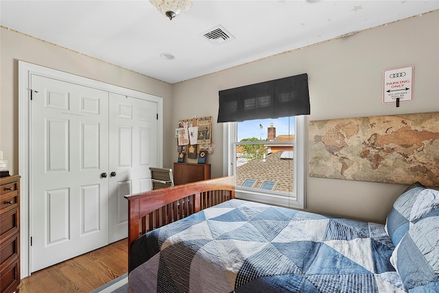 15707 22nd Ave, Whitestone, NY 11357 - bedroom with wood finished floors and a closet