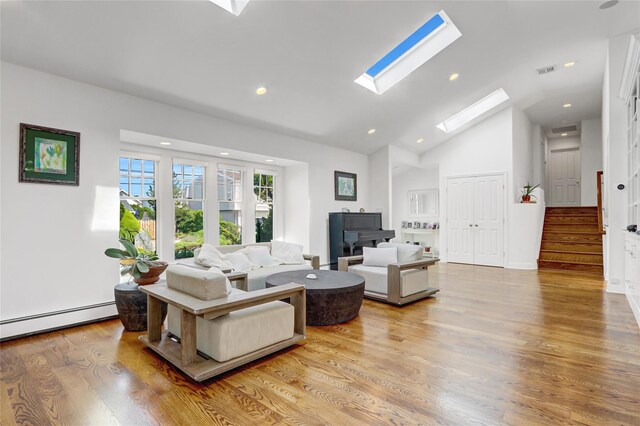 62 Woodhail St, Lido Beach, NY 11561 - living area with a skylight, a baseboard radiator, wood finished floors, recessed lighting, and stairway