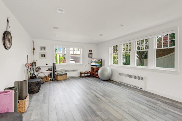 62 Woodhail St, Lido Beach, NY 11561 - interior space featuring radiator heating unit, wood finished floors, and recessed lighting