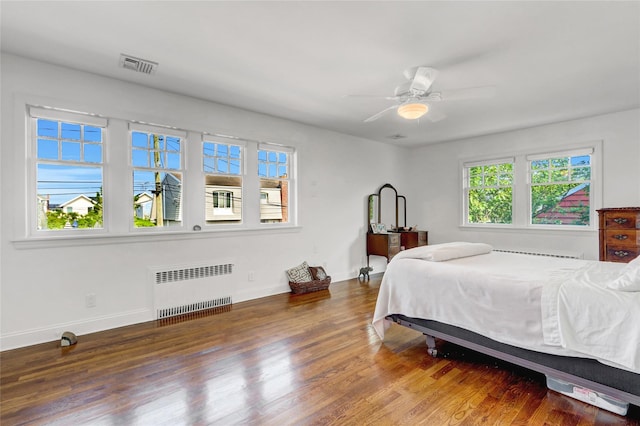 62 Woodhail St, Lido Beach, NY 11561 - bedroom featuring radiator heating unit, baseboards, and wood finished floors