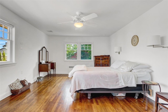 62 Woodhail St, Lido Beach, NY 11561 - bedroom with wood finished floors, a ceiling fan, and baseboards