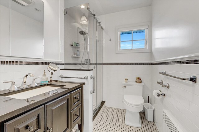 62 Woodhail St, Lido Beach, NY 11561 - full bath with tile walls, toilet, radiator heating unit, vanity, and a shower stall