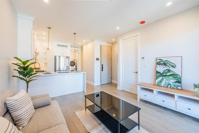 4209 Hampton St Unit 2A, Elmhurst, NY 11373 - living area with light wood-type flooring, recessed lighting, washer / clothes dryer, and baseboards