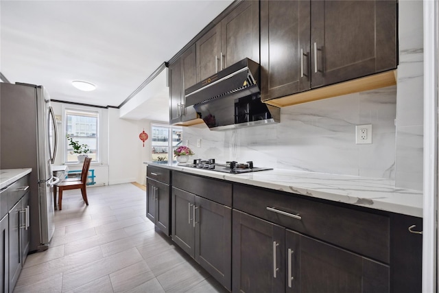 134-54 Maple Ave Unit 3W, Flushing, NY 11355 - kitchen with freestanding refrigerator, gas stovetop, dark brown cabinetry, tasteful backsplash, and range hood
