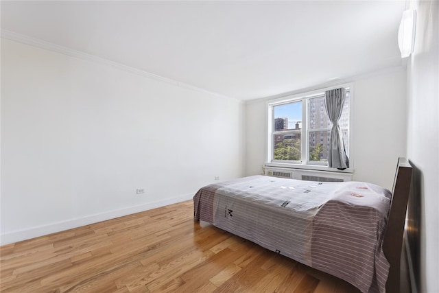134-54 Maple Ave Unit 3W, Flushing, NY 11355 - bedroom featuring ornamental molding, wood finished floors, and baseboards