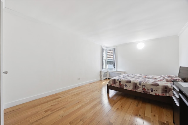 134-54 Maple Ave Unit 3W, Flushing, NY 11355 - bedroom featuring crown molding, light wood-style flooring, and baseboards