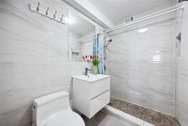 134-54 Maple Ave Unit 3W, Flushing, NY 11355 - bathroom with vanity, toilet, and a tile shower