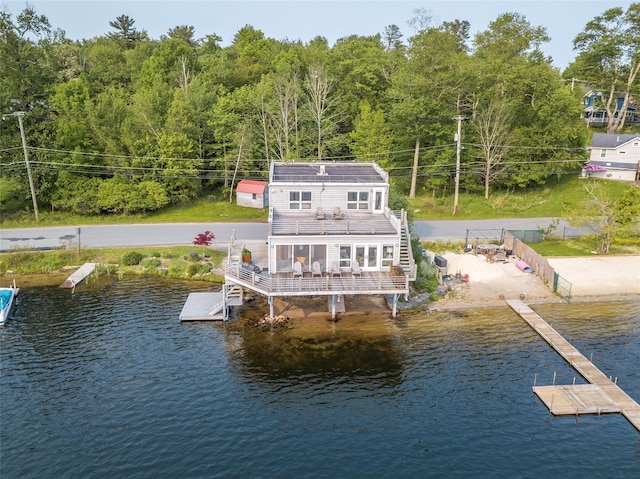 13 W Shore Rd, Kauneonga Lake, NY 12749 - dock area featuring a water view and a wooded view