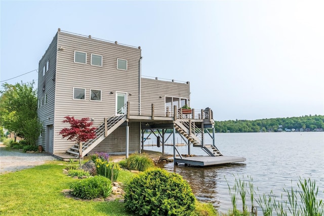 13 W Shore Rd, Kauneonga Lake, NY 12749 - rear view of property with stairway and a deck with water view