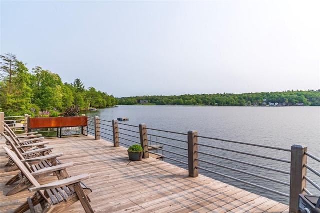 13 W Shore Rd, Kauneonga Lake, NY 12749 - wooden deck with a water view and a view of trees
