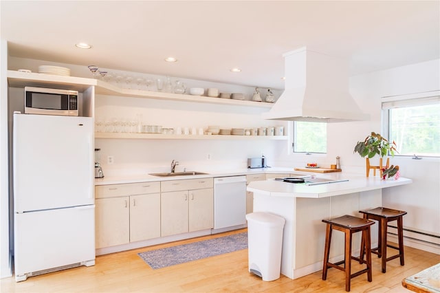 13 W Shore Rd, Kauneonga Lake, NY 12749 - kitchen featuring white appliances, a sink, premium range hood, open shelves, and a peninsula