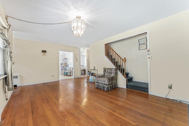 17 Linn Pl, Yonkers, NY 10705 - living area featuring a chandelier, stairway, and wood-type flooring
